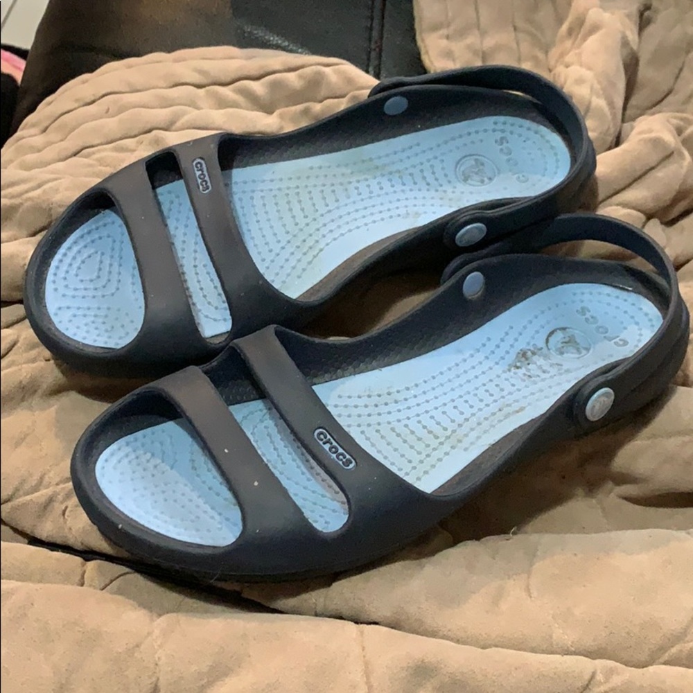 Woman’s blue crocs
